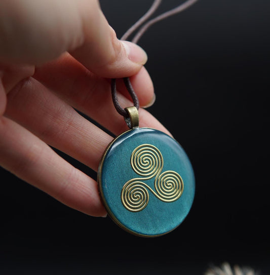 Orgonite Talisman – Triskele in Turquoise – Jewelry for Harmony & Centering